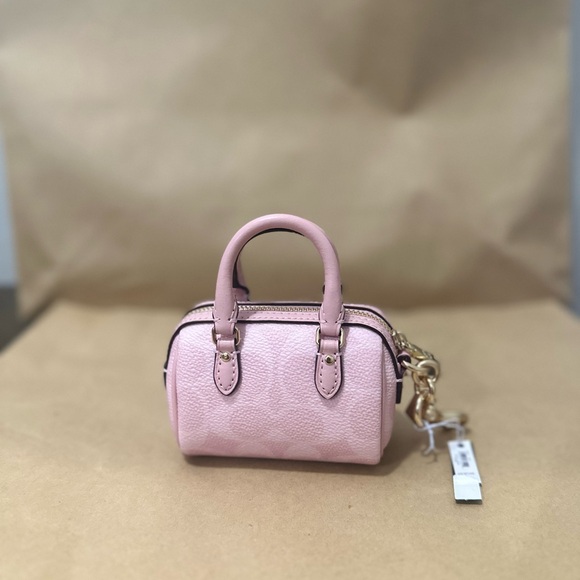 🌸🌸🎀 Coach Mini Rowan Bag Charm In Signature Canvas NEW POWDER PINK COLLECTION - Picture 2 of 2